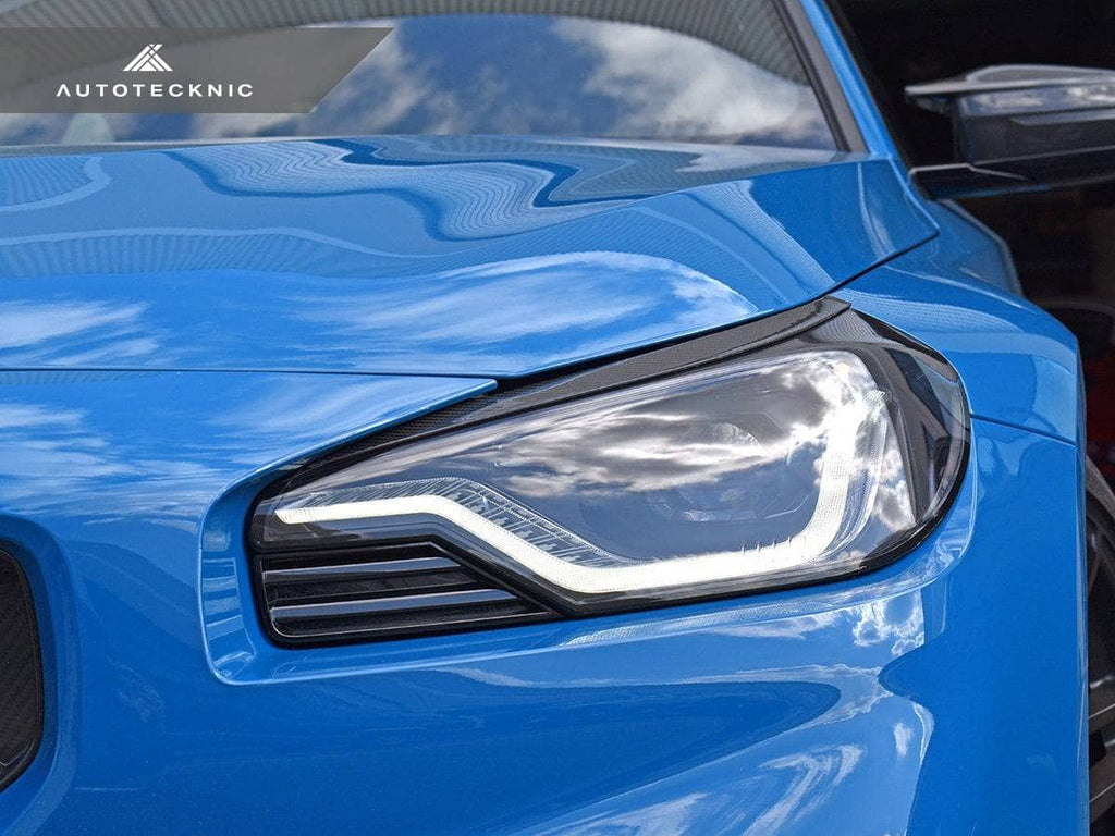 AutoTecknic Carbon Fiber Headlight Trim Set - BMW G87 M2